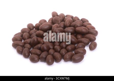 Peanuts covered in chocolate isolated on white Stock Photo