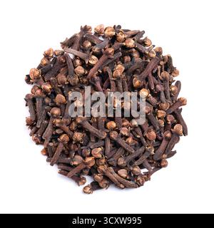 Dried cloves, circle on white background. Circle shape made with a bunch of aromatic flower buds of Syzygium aromaticum. Stock Photo