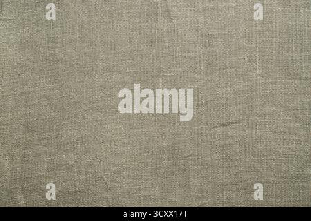 Close up view of stone taupe woven fabric. Quality natural textile texture ideal for backgrounds or design Stock Photo