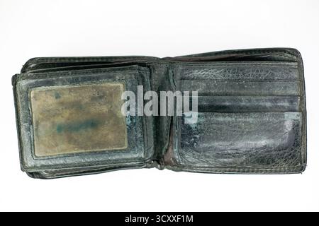 close up of black shabby leather wallet isolated on white background Stock Photo