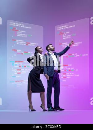 Creative graphic artwork. Business team analyzing holographic programming screen in futuristic workspace Stock Photo