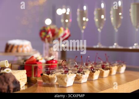 Buffet menu. Delicious desserts and drinks on table, selective focus Stock Photo