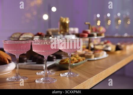 Buffet menu. Delicious desserts and drinks on table, selective focus Stock Photo