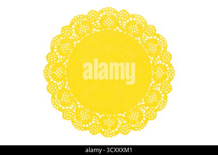 Yellow paper doily on white background Stock Photo