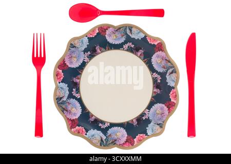 Blue floral paper plate and red plastic cutlery on white background Stock Photo