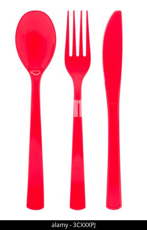 Red plastic cutlery on white background Stock Photo