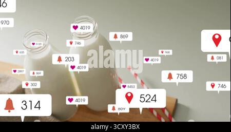 Placing two glass milk bottles on wooden board in kitchen, with straws, floating notification icons Stock Photo