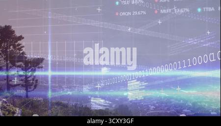 Displaying glowing binary code streams and floating percentages over hillside and valley town Stock Photo