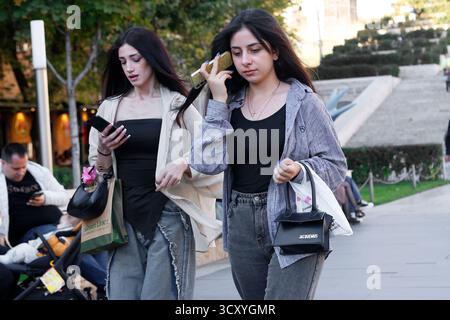 Young women using their smartphones in Yerevan, Armenia Stock Photo