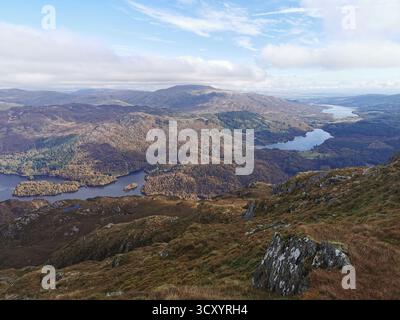 Panoramic view from Ben Venue summit over Loch Venacher, Loch Achray & Loch Katrine in Scotland’s Trossachs National Park – scenic Highlands landscape Stock Photo