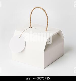 Mockup of white box with handle. Stock Photo