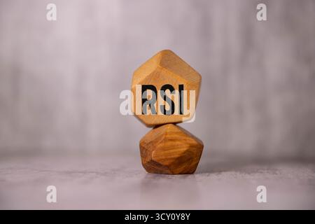Word RSI word is made up of wooden cubes on a black background Stock Photo