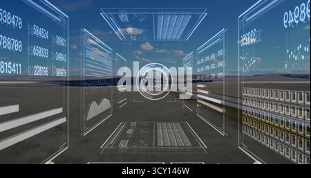Displaying holographic panels showing numerical readouts and charts over arid plain with HUD Stock Photo