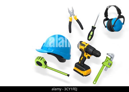 Various construction tools including wrench, hammer, pliers, and helmet isolated on white background with clipping path, concept of building work Stock Photo