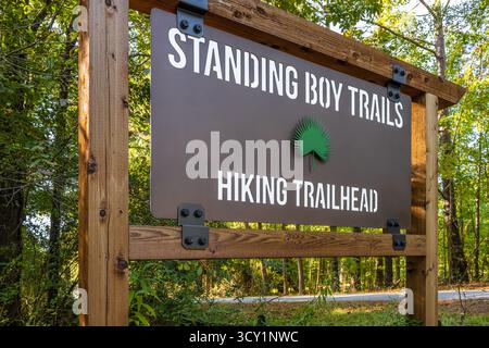 Trailhead sign for Standing Boy Trails, a trail system with nearly 30 miles of natural surface trails for hiking, running, and biking in Columbus, GA. Stock Photo