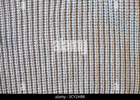 Gray knitted textile showing a textured waffle weave. Pattern and background Stock Photo
