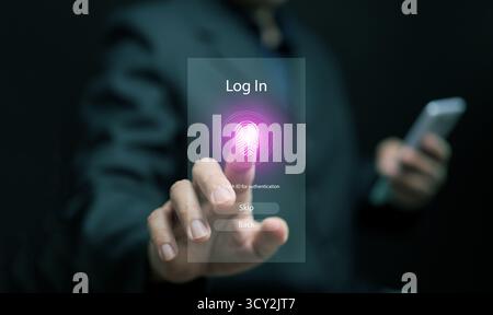 Hand pressing fingerprint icon for login access on virtual screen with smartphone, representing biometric authentication, digital identity security, a Stock Photo
