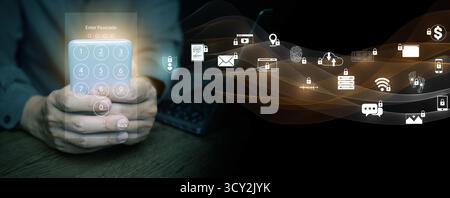 Hand holding smartphone with virtual keypad and secure icons, representing digital privacy, data encryption, mobile banking protection, and technology Stock Photo