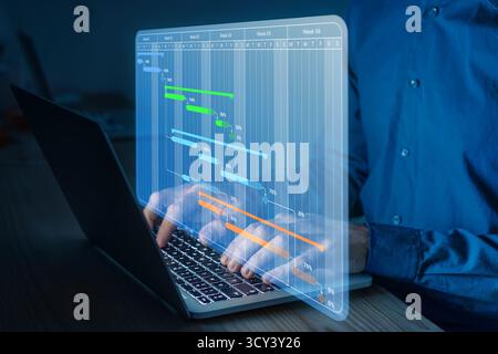Project Management Planning with Gantt Chart on Laptop. Digital Schedule, Workflow Optimization, Task Tracking, and Team Coordination Stock Photo