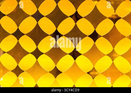 Yellow decorative translucent glass with a diamond pattern Stock Photo