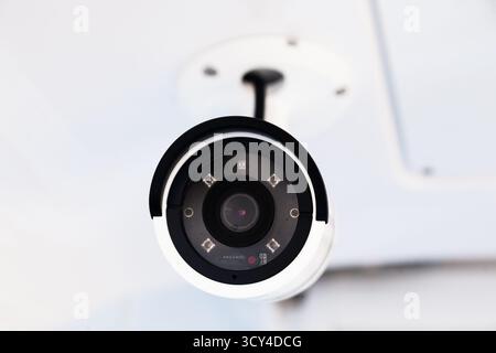 CCTV camera on the hull of an expensive motor yacht. CCTV camera white on a white body Stock Photo
