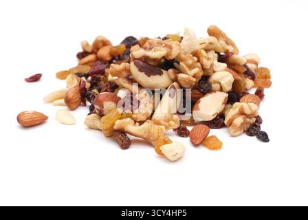 Mix Of Nuts And Dry Fruits Isolated On A White Background, Almonds, Walnuts, Hazelnuts And Raisins On A Pile, Healthy Food Stock Photo