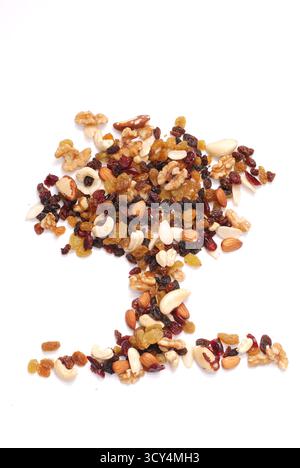 Mix Of Nuts And Dried Fruits Isolated On A White Background, Almonds, Walnuts, Hazelnuts And Raisins On A Pile, Healthy Food Stock Photo