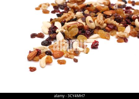 Mix Of Nuts And Dry Fruits Isolated On A White Background, Almonds, Walnuts, Hazelnuts And Raisins On A Pile, Healthy Food Stock Photo