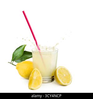 glass of lemonade with lemons and pink straw on white background. Stock Photo