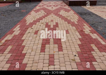 Belarusian patterns are lined with multi-colored paving slabs Stock Photo