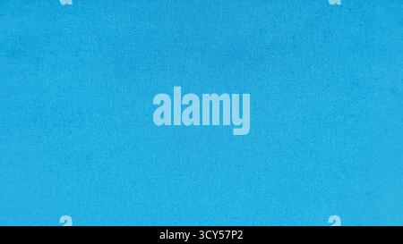 Vibrant Deep Cyan Blue Fabric Texture Background with Subtle Woven Pattern and Uniform Color, Ideal for Water, Ocean, or Copy Space Themes. Stock Photo
