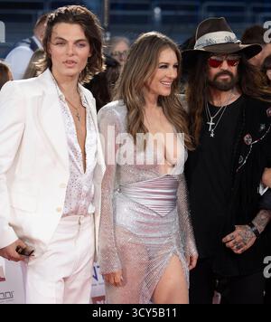 Damian Hurley, Elizabeth Hurley and Billy Ray Cyrus attend the