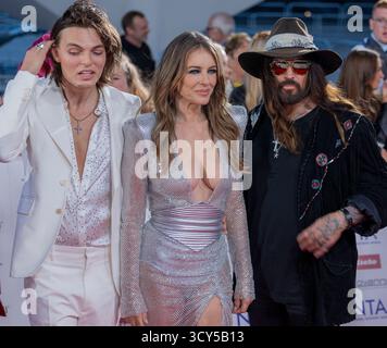 Damian Hurley, Elizabeth Hurley and Billy Ray Cyrus attend the