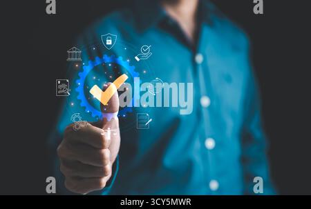 Standard quality control certification assurance guarantee concept. Businessman touching the check mark approve certificate. Quality assurance QA, Qua Stock Photo
