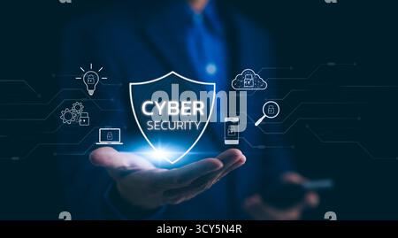 Cyber security shield digital protection concept. A professional presents a cyber security shield hologram, symbolizing advanced digital protection an Stock Photo