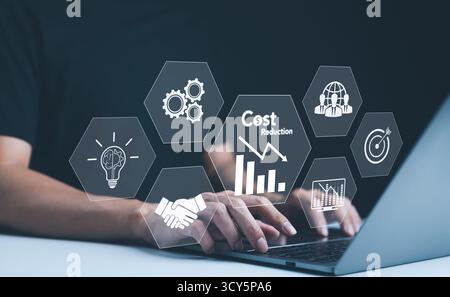 Cost reduction concept. Quality increase and cost optimization, Hands typing on a laptop with digital icons representing business efficiency and cost Stock Photo