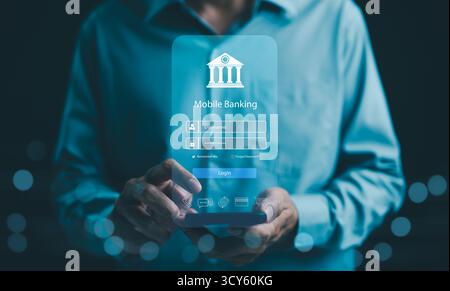 Mobile banking technology concept. Businessman with mobile banking app login screen on smartphone. convenience and security of online financial Stock Photo
