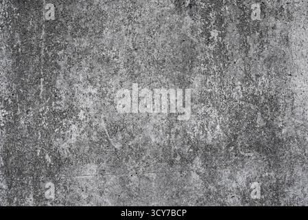 Old weathered gray concrete wall with cracks and scuff marks, useful for graphic design, printing, interior visualization, and industrial style projec Stock Photo