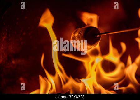 A marshmallow being roasted over an open fire, Whinfell Forest, Brougham, 08/10/2025. Image Credit: Colin Poultney/CollargeImages Stock Photo