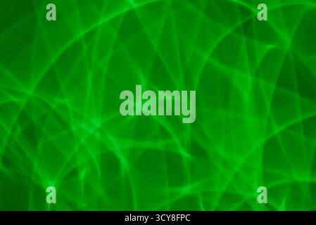An abstract background created with green light painting techniques. The futuristic, swirling lines represent concepts like technology, data, energy, Stock Photo