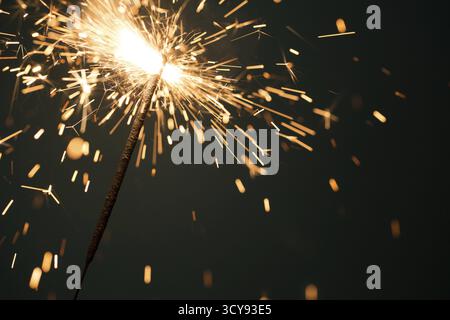Burning Bengal fire on black background empty Stock Photo