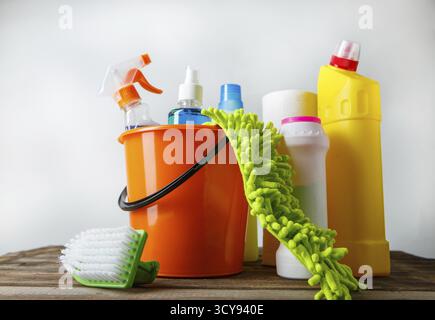 Bucket with cleaning items on light background Stock Photo
