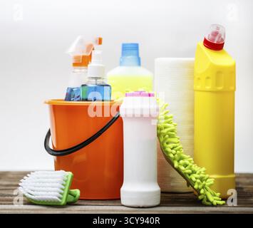 Bucket with cleaning items on light background Stock Photo