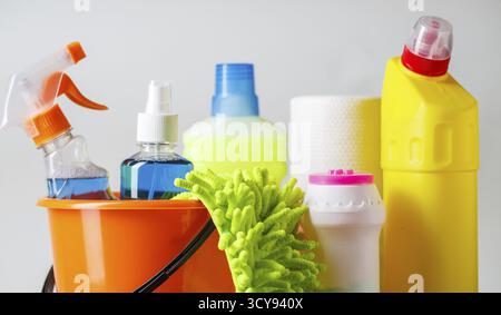 Bucket with cleaning items on light background Stock Photo
