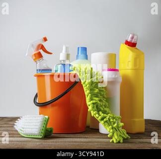 Bucket with cleaning items on light background Stock Photo