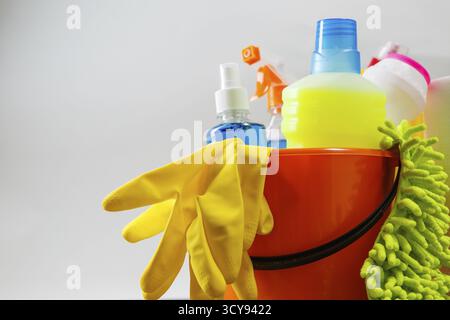 Bucket with cleaning items on light background Stock Photo