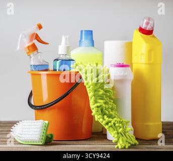 Bucket with cleaning items on light background Stock Photo
