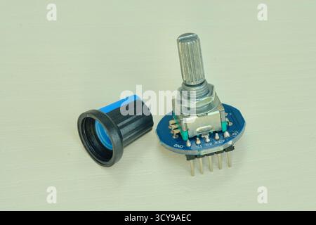 Variable resistor isolated on white background. Electronic parts concept. potentiometer. Stock Photo