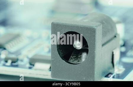 Electronic components, chips and capacitors on the blue pcb, close up view. Technology concept Stock Photo
