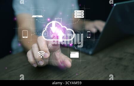 Futuristic concept of cloud data transfer and cybersecurity. Hand pointing to digital cloud icon. Upload and download process for online storage and m Stock Photo